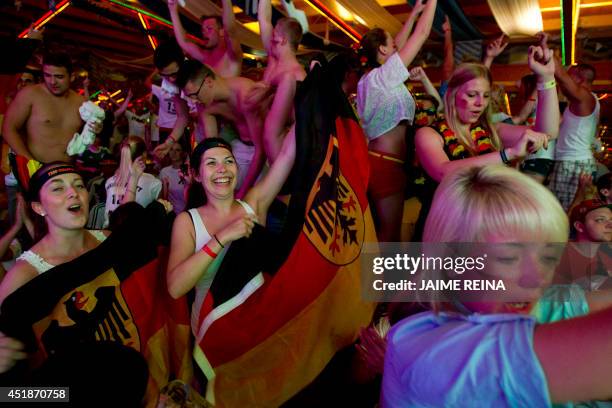 Germany fans celebrate at the end of the 2014 FIFA World Cup semi final football match between Brazil and Germany in Palma de Mallorca on July 8,...