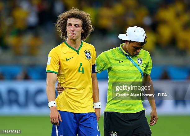 David Luiz and Thiago Silva of Brazil show their dejection after the 1-7 defeat in the 2014 FIFA World Cup Brazil Semi Final match between Brazil and...