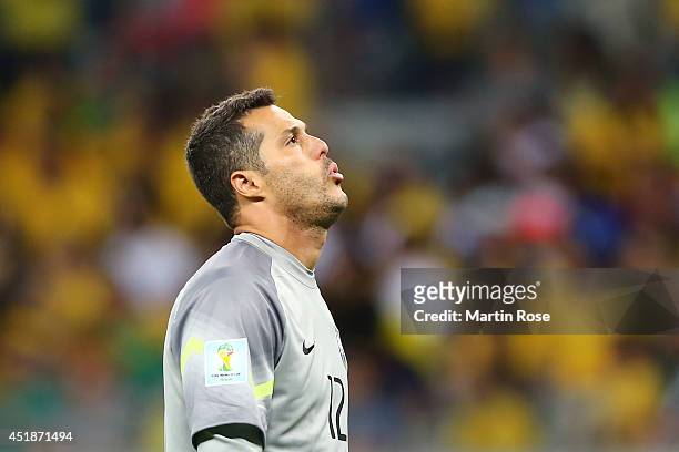 Goalkeeper Julio Cesar of Brazil reacts during the 2014 FIFA World Cup Brazil Semi Final match between Brazil and Germany at Estadio Mineirao on July...