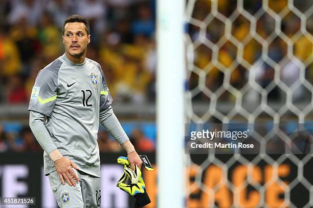 Goalkeeper Julio Cesar of Brazil looks dejected after a7-1 defeat to Germany during the 2014 FIFA World Cup Brazil Semi Final match between Brazil...