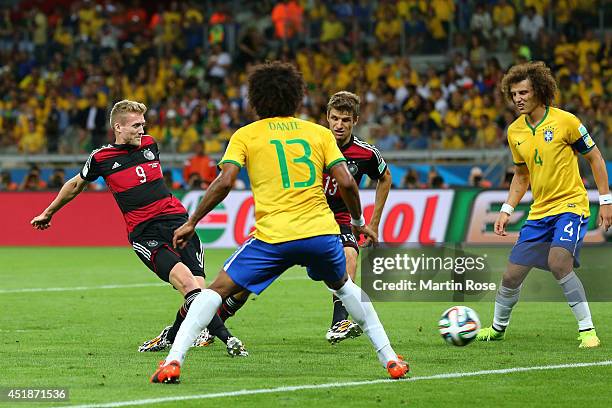 Andre Schuerrle of Germany scores his team's sixth goal against Dante and David Luiz of Brazil during the 2014 FIFA World Cup Brazil Semi Final match...