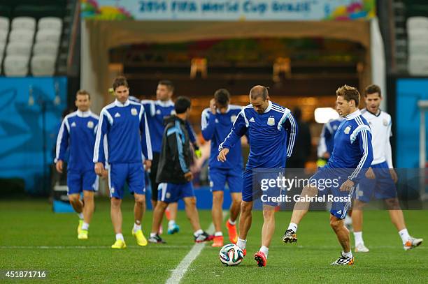 Javier Mascherano controls the ball during a training session at Arena Corinthians on July 08, 2014 in Sao Paulo, Brazil. Argentina will face The...