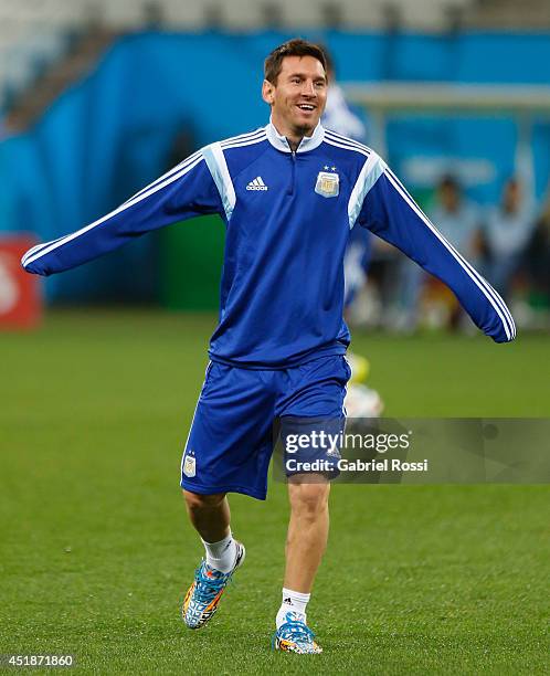 Lionel Messi warms up during a training session at Arena Corinthians on July 08, 2014 in Sao Paulo, Brazil. Argentina will face The Netherlands as...