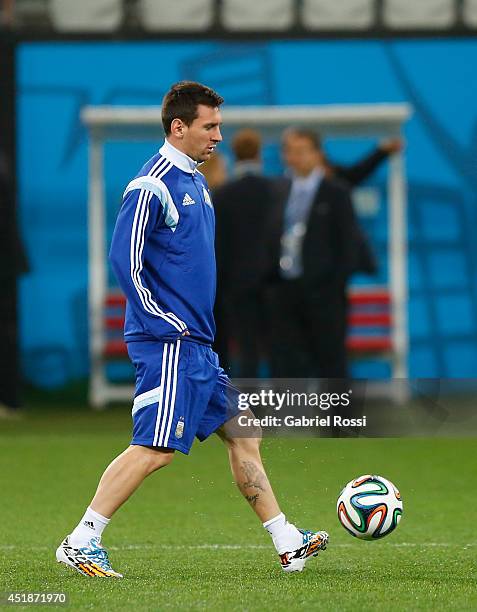 Lionel Messi controls the ball during a training session at Arena Corinthians on July 08, 2014 in Sao Paulo, Brazil. Argentina will face The...