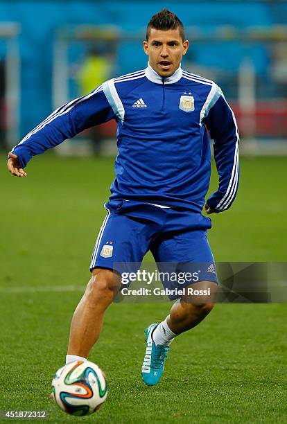 Sergio Agüero controls the ball during a training session at Arena Corinthians on July 08, 2014 in Sao Paulo, Brazil. Argentina will face The...