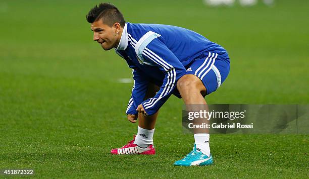 Sergio Agüero warms up during a training session at Arena Corinthians on July 08, 2014 in Sao Paulo, Brazil. Argentina will face The Netherlands as...