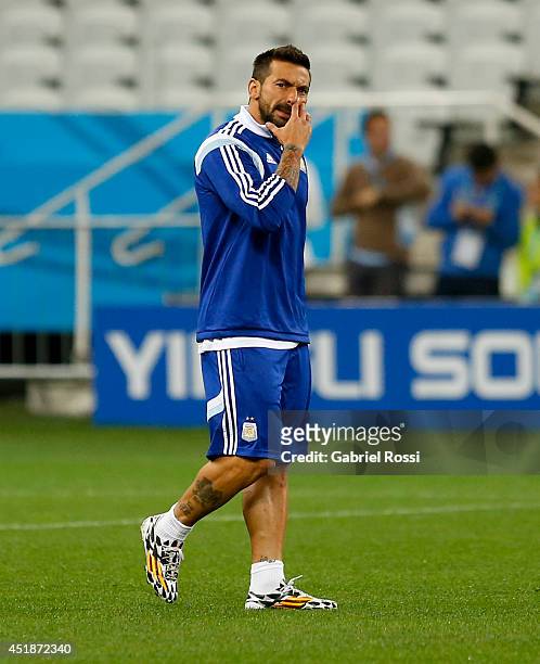 Ezequiel Lavezzi gestures while he walks during a training session at Arena Corinthians on July 08, 2014 in Sao Paulo, Brazil. Argentina will face...