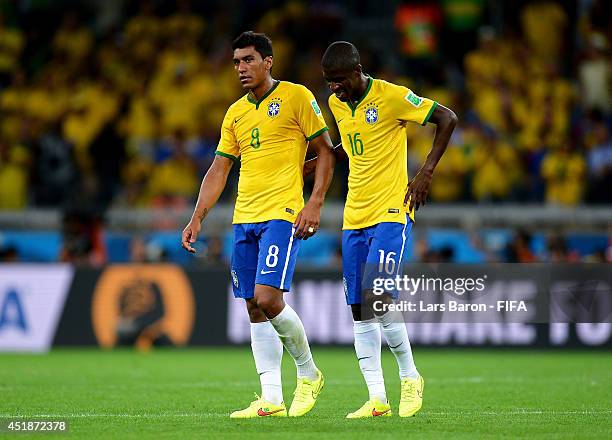 Paulinho and Ramires of Brazil show their dejeciton after 1-7 defeat in the 2014 FIFA World Cup Brazil Semi Final match between Brazil and Germany at...