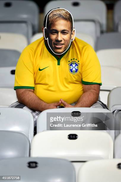 Brazil fan wearing a Neymar mask looks on after a 7-1 defeat to Germany during the 2014 FIFA World Cup Brazil Semi Final match between Brazil and...