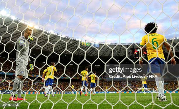 Julio Cesar of Brazil looks dejected after the opening goal scored by Thomas Mueller of Germany during the 2014 FIFA World Cup Brazil Semi Final...