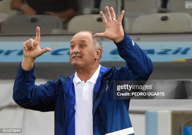 Brazil's coach Luiz Felipe Scolari gestures during the semi-final football match between Brazil and Germany at The Mineirao Stadium in Belo Horizonte...