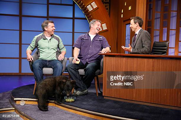 Episode 066 -- Pictured: Chris Kratt and Martin Kratt of Kratts' Creatures bring a baby black bear to an interview with host Seth Meyers on July 8,...