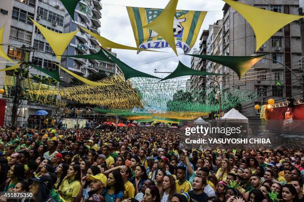 Brazil's fans react during a public viewing event at a street in Rio de Janeiro during the 2014 FIFA World Cup semifinal match Brazil vs Germany...