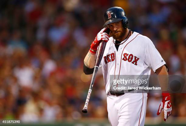 Jonny Gomes of the Boston Red Sox reacts after striking out against the Chicago White Sox during the game at Fenway Park on July 8, 2014 in Boston,...