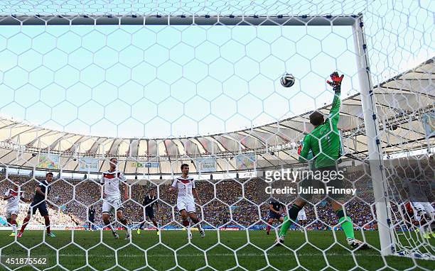 Manuel Neuer of Germany saves a shot from Karim Benzema of France during the 2014 FIFA World Cup Brazil Quarter Final match between France and...