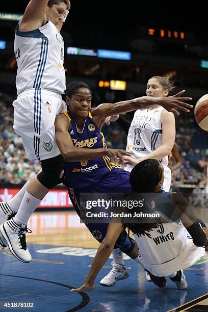 Tan White of the Minnesota Lynx takes a charge from Alana Beard of the Los Angeles Sparks during the WNBA game on July 8, 2014 at Target Center in...