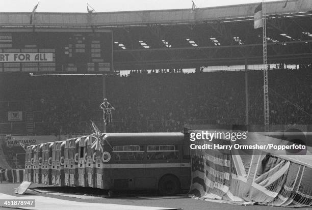 American motorcycle stunt rider Evel Knievel attempts to jump 13 AEC Merlin buses at Wembley Stadium, London, 26th May 1975. Knievel crashed his...