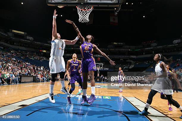 Janel McCarville of the Minnesota Lynx goes for the shot against Jantel Lavender of the Los Angeles Sparks during the WNBA game on July 8, 2014 at...