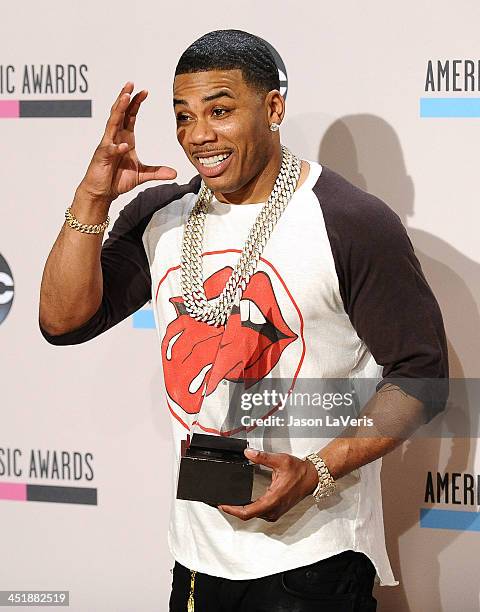 Nelly poses in the press room at the 2013 American Music Awards at Nokia Theatre L.A. Live on November 24, 2013 in Los Angeles, California.