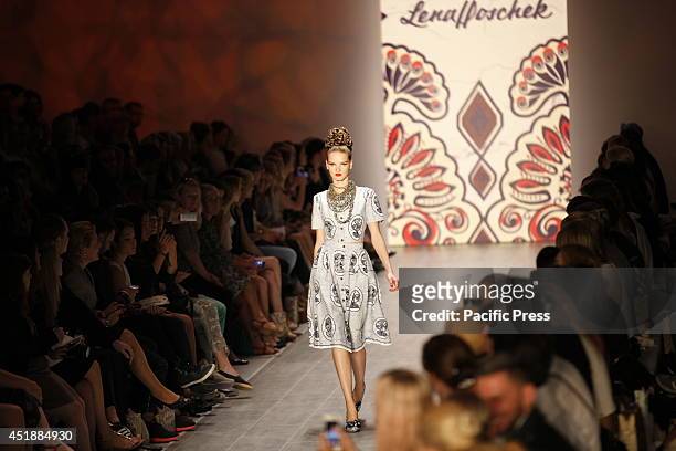 Model wears a creation of Lena Hoschek during the Mercedes-Benz Fashion Week Berlin Spring / Summer 2015.