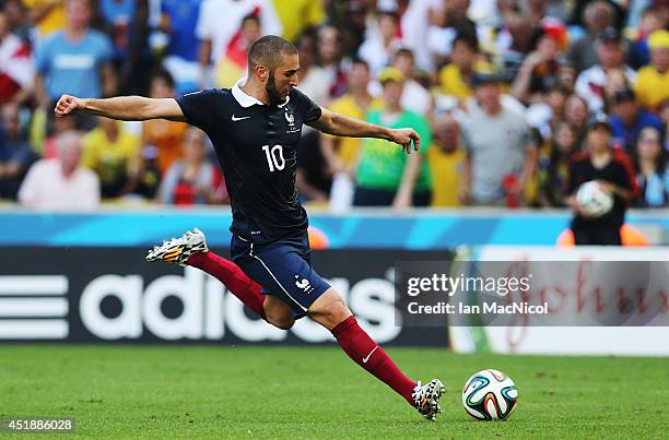 Karim Benzema of France strikes the ball during the 2014 FIFA World Cup Brazil Quarter Final match between France and Germany at The Maracana on July...