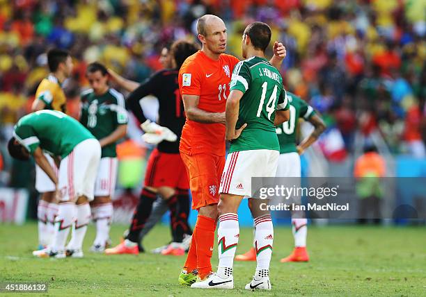 Dejected Javier 'Chicharito' Hernandez of Mexico is comforted by Arjen Robben of Netherlands during the Round of 16 match of the 2014 World Cup...