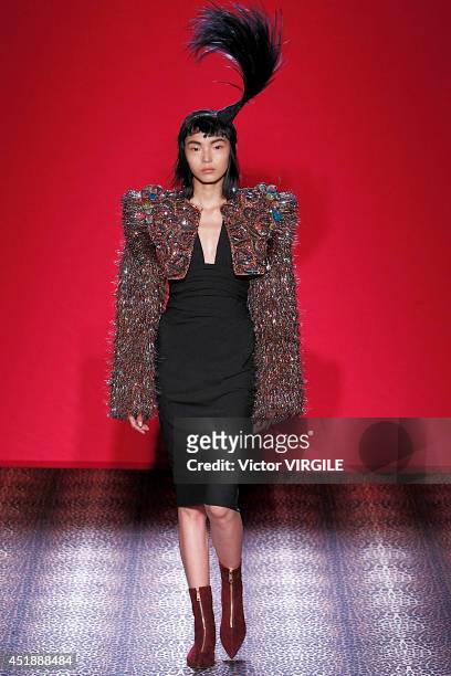 Xiao Wen Ju walks the runway during the Schiaparelli show as part of Paris Fashion Week - Haute Couture Fall/Winter 2014-2015 on July 7, 2014 in...