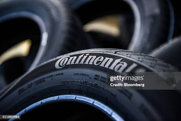 Continental logo sits on the side wall of a newly manufactured automobile tire at the Continental AG automobile tire manufacturing plant in...