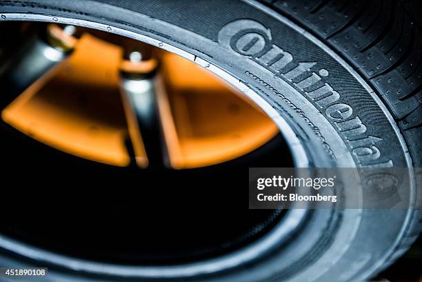 Continental logo sits on the side wall of a newly manufactured automobile tire at the Continental AG automobile tire manufacturing plant in...
