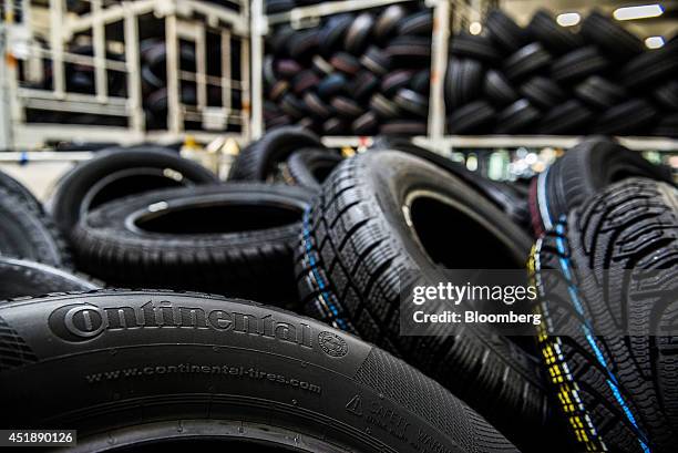 Continental logo sits on the side wall of a newly manufactured automobile tire in a tire storage bay at the Continental AG automobile tire...