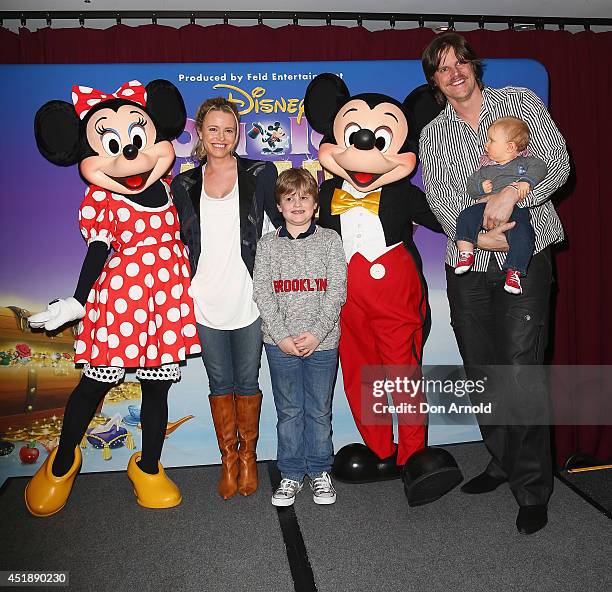 Haley Bracken and Nathan Bracken pose alongside their children at the Disney On Ice Premiere at Allphones Arena on July 9, 2014 in Sydney, Australia.