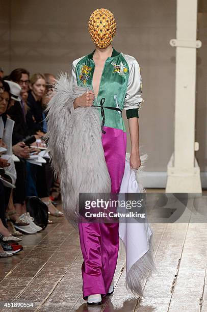 Model walks the runway at the Maison Martin Margiela Autumn Winter 2014 fashion show during Paris Haute Couture Fashion Week on July 9, 2014 in...