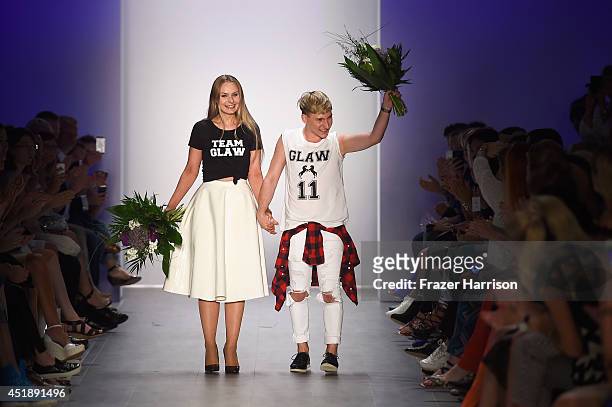 Designers Jesko Wilke and Maria Poweleit acknowledge the audience at the Glaw show during the Mercedes-Benz Fashion Week Spring/Summer 2015 at Erika...