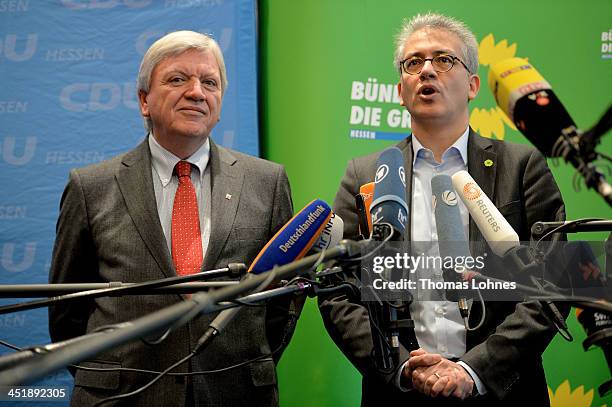 The prime minister of hesse Volker Bouffier of the German Christian Democrats and Tarek Al Wazir of the German Greens Party give a press statement...