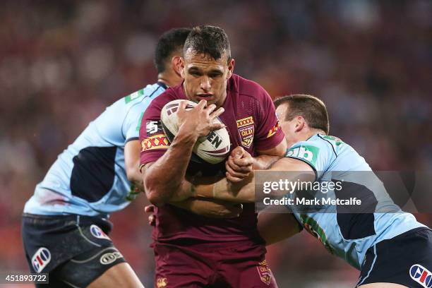 Will Chambers of the Maroons is tackled during game three of the State of Origin series between the Queensland Maroons and the New South Wales Blues...