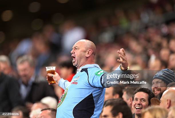 Blues fan shows his support during game three of the State of Origin series between the Queensland Maroons and the New South Wales Blues at Suncorp...