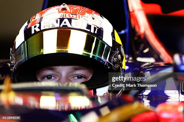 Daniil Kvyat of Russia and Scuderia Toro Rosso sits in his car in the garage during day two of testing at Silverstone Circuit on July 9, 2014 in...