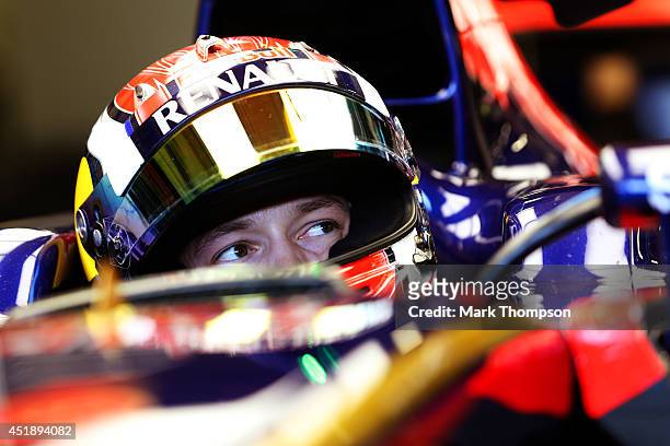 Daniil Kvyat of Russia and Scuderia Toro Rosso sits in his car in the garage during day two of testing at Silverstone Circuit on July 9, 2014 in...