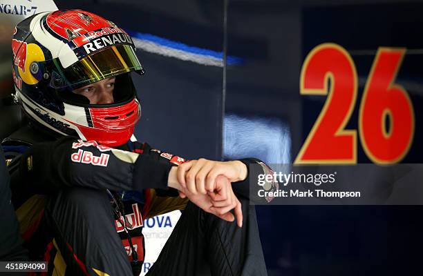Daniil Kvyat of Russia and Scuderia Toro Rosso sits in the garage during day two of testing at Silverstone Circuit on July 9, 2014 in Northampton,...