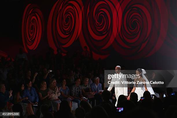 Bruce Darnell and Rebecca Mir seen during the Minx by Eva Lutz show during the Mercedes-Benz Fashion Week Spring/Summer 2015 at Erika Hess Eisstadion...