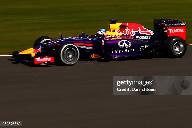 Sebastian Vettel of Germany and Infiniti Red Bull Racing drives during day two of testing at Silverstone Circuit on July 9, 2014 in Northampton,...