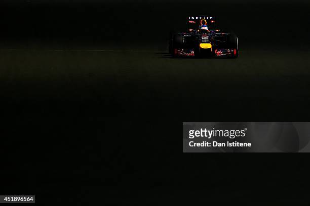 Sebastian Vettel of Germany and Infiniti Red Bull Racing drives during day two of testing at Silverstone Circuit on July 9, 2014 in Northampton,...