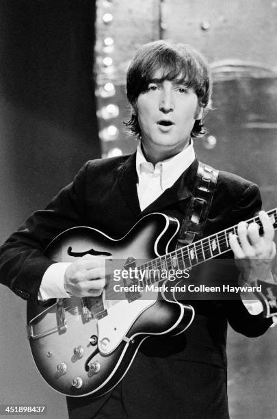 John Lennon from The Beatles performs 'Rain' and 'Paperback Writer' on BBC TV show 'Top Of The Pops' in London on 16th June 1966.