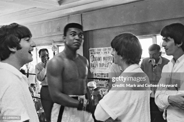 18th FEBRUARY: Boxer Cassius Clay meets John Lennon , Ringo Starr and George Harrison of The Beatles at his training centre in Miami, Florida on 18th...