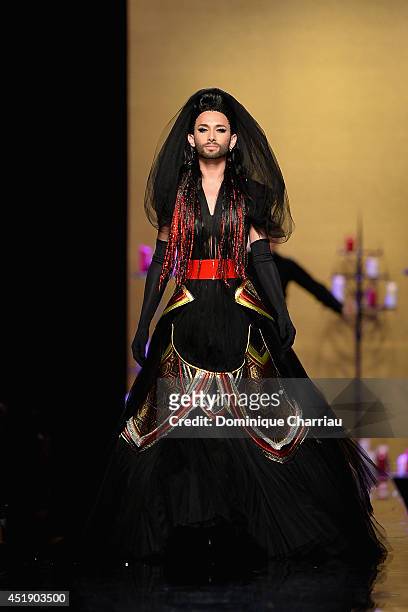 Conchita Wurst walks the runway during the Jean Paul Gaultier show as part of Paris Fashion Week - Haute Couture Fall/Winter 2014-2015 at 325 Rue...