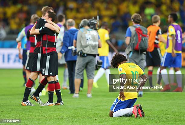 Willian of Brazil reacts after the 1-7 defeat in the 2014 FIFA World Cup Brazil Semi Final match between Brazil and Germany at Estadio Mineirao on...
