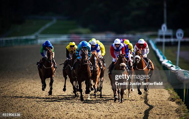 Underwritten riden by Martin Harley leads into the first bend in the 32Red Casino Handicap at Lingfield Park on July 9, 2014 in Lingfield, England.