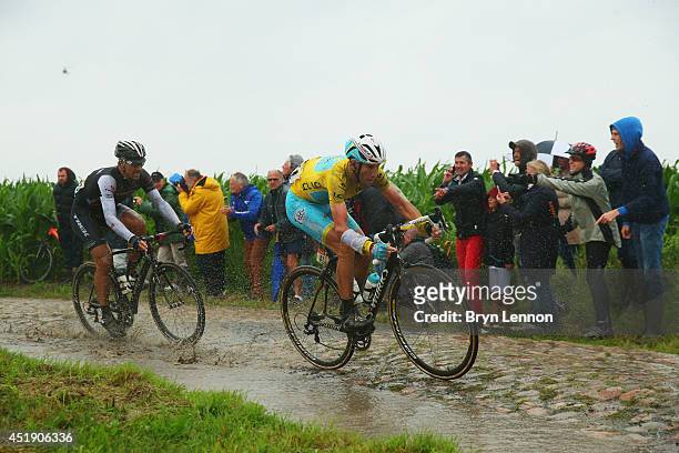 Fabian Cancellara of Switzerland and Trek Factory Racing Team and race leader Vincenzo Nibali of Italy and the Astana Pro Team in action on the pave...