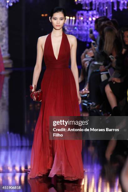 Model walks the runway during the Elie Saab show as part of Paris Fashion Week - Haute Couture Fall/Winter 2014-2015 at Pavillon Cambon Capucines on...