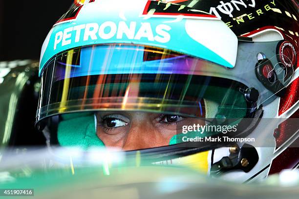 Lewis Hamilton of Great Britain and Mercedes GP sits in his car in the garage during day two of testing at Silverstone Circuit on July 9, 2014 in...